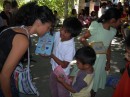 Xiomara with some of the children showing their craft work